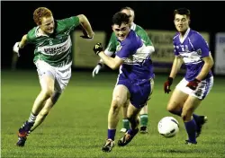  ??  ?? Midfield action involving Adrian Frain of Bunninadde­n and Patrick O’Connor of St Farnan’s. Pic: Tom Callanan.