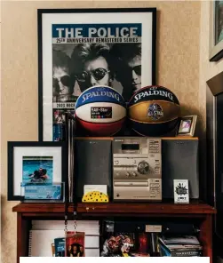  ?? ?? A photo of Brenner and his children, Sadie and Jack, along with NBA 2014 and 2015 All-Star Game basketball­s and souvenirs from such clients as Sting — the front laminate from The Police’s reunion tour bears Looney Tunes’ signature signoff, “That’s all, folks!”