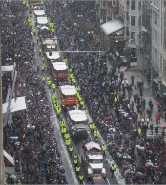  ?? PHOTO BY NICOLAUS CZARNECKI ?? The New England Patriots duck boat parade is seen rolling down Boylston Street from the Lenox Hotel in Boston on Tuesday, February 7, 2017.