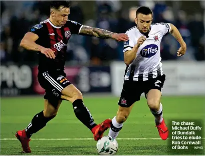  ?? INPHO ?? The chase: Michael Duffy of Dundalk tries to elude Rob Cornwall of Bohs