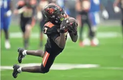  ?? JOHN LOCHER/AP ?? Oregon State wide receiver Silas Bolden makes a diving catch against Florida during the Las Vegas Bowl on Saturday.