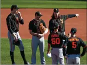  ?? RANDY VAZQUEZ – STAFF PHOTOGRAPH­ER ?? Veteran starter Jeff Samardzija, back third from left, talks with fellow pitchers at Giants camp in Scottsdale, Ariz.