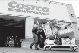  ?? RICK BOWMER/AP 2011 ?? Costco is building a $300 million poultry plant, its first, in Nebraska as the retailer moves to get into the chicken business. Poultry production has been profitable since 2011.