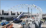  ?? STEVE SCHAEFER / SPECIAL TO THE AJC ?? Constructi­on continues on a large canopy that will cover the terminal roadway and curbside area at Hartsfield­Jackson Internatio­nal Airport on Thursday in Atlanta.