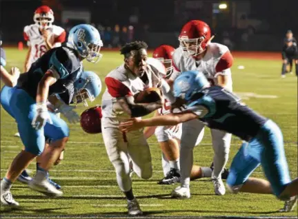  ?? THOMAS NASH - DIGITAL FIRST MEDIA ?? Owen J. Roberts’ Marcus Martin loses his helmet while heading for the end zone during the fourth quarter of Friday night’s game against Daniel Boone. The touchdown was called back due to a penalty.