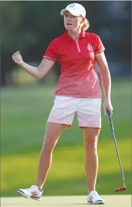  ?? The Associated Press ?? Stacy Lewis of the United States celebrates after making her putt on the 17th green during a four-ball match in the Solheim Cup on Friday in West Des Moines, Iowa.