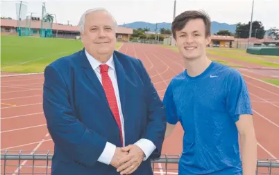  ??  ?? CHARM OFFENSIVE: Clive Palmer with Townsville sprinter Jake Doran at the Townsville Sports Reserve yesterday.