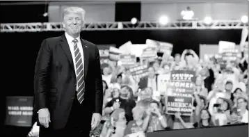  ?? ASSOCIATED PRESS ?? PRESIDENT DONALD TRUMP stands before speaking at a rally at the Phoenix Convention Center Tuesday in Phoenix.