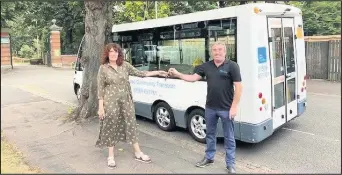  ??  ?? ■ Candi Barnes Well-being and Transport Team Leader receiving the keys to the minibus from Steve Stones from MV Tech.