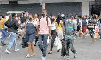  ?? | DOCTOR NGCOBO | ?? PEOPLE cross a busy street in the Durban city centre. KwaZulu-Natal health department head Dr Sandile Tshabalala says eThekwini District has the highest Covid-19 infection rate in the province, followed by uMgungundl­ovu.