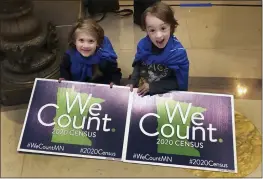  ?? STEVE KARNOWSKI — THE ASSOCIATED PRESS FILE ?? Noelle Fries, 6, left, and Galen Biel, 6, both of Minneapoli­s, attend a rally at the Minnesota Capitol to kick off a year-long drive to try to ensure that all Minnesota residents are counted in the 2020 census.