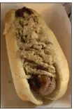  ?? (Arkansas Democrat-Gazette/ Eric E. Harrison) ?? Fassler Hall tops its bratwurst with house kraut and brown mustard.