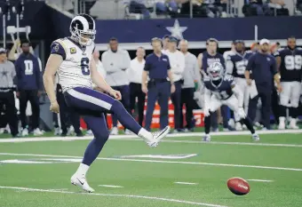  ?? ROGER STEINMAN/ASSOCIATED PRESS FILE ?? Los Angeles Rams punter Johnny Hekker attempts an onside kick during a game last season. The NFL is considerin­g an alternativ­e to the onside kick since it has become infrequent and rarely successful.