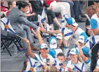  ?? $1 1)050 ?? Prime Minister Trudeau high fives some young Nova Scotia athletes at the Canada Summer Games opening ceremony in Winnipeg last night.
