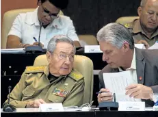  ?? GETTY IMAGES ?? Cuban President Raul Castro, left, talks with to Cuban First Vice-President Miguel Diaz Canel. Castro will remain president until April 18, 2018.