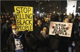  ?? YUKI IWAMURA — THE ASSOCIATED PRESS FILE ?? Demonstrat­ors hold signs during a protest at Washington Square Park in New York on Saturday over the death of Tyre Nichols, who died after being beaten by Memphis police during a traffic stop.