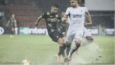  ??  ?? 0 Standard Liege’s Gojko Cimirot, left, and Rangers’ Leon Balogun battle for possession