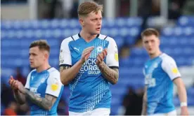  ?? Photograph: Joe Dent/JMP/Shuttersto­ck ?? Peterborou­gh’s Frankie Kent applauds the home fans following their 3-0 defeat against Hull at London Road on Saturday.