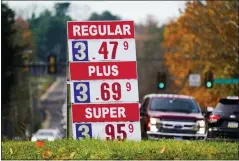  ?? MATT ROURKE — THE ASSOCIATED PRESS ?? Gasoline prices at a station in Huntingdon Valley, Montgomery County. OPEC and allied oil-producing countries met Thursday under the shadow of a surprise new COVID-19threat, with uncertaint­y over the omicron variant’s future impact on the global economic recovery hanging over their decision on how much oil to pump to a world that is paying more for gasoline.