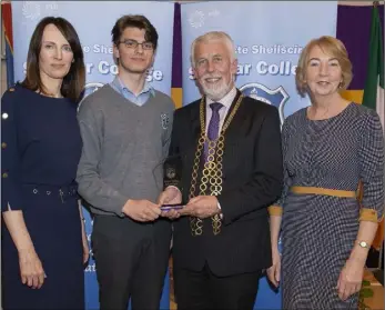  ??  ?? Overall Junior Student of the Year award winner Simun Cakic receives his award from Mayor of Wexford Jim Moore. Also pictured are principal Eimear Ryan and Eilis Leddy of the WWETB.