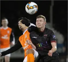  ??  ?? Winger Mark Slater tussles with Jose Viegas who scored the first Athlone Town goal.