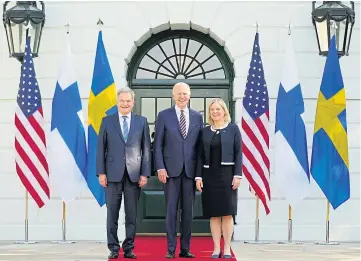  ?? ?? SUPPORT: US President Joe Biden, centre, greets President Sauli Niinisto of Finland and Prime Minister Magdalena Andersson of Sweden as they arrive at the White House.
