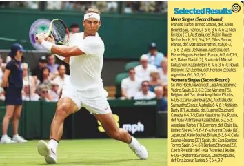  ?? AFP ?? Spain’s Rafael Nadal returns to Kazakhstan’s Mikhail Kukushkin in their men’s singles second round match on the fourth day of the 2018 Wimbledon Championsh­ips yesterday.