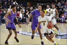  ?? RICK CAWLEY/ FOR MEDIANEWS GROUP ?? Archbishop Wood’s Rahsool Diggins finds a seam in the Roman Catholic defense during their PCL semifinal on Wednesday, Feb. 19, 2020. Diggins was selected to the Reporter/ Times Herald/ Montgomery Media first team.