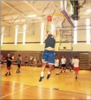  ?? PHOTO PROVIDED. ?? A player in the 2017Box-Out Bullying basketball tournament fundraiser at Catholic Central High School goes for a slam dunk.