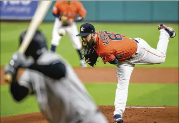  ?? TONY GUTIERREZ / ASSOCIATED PRESS ?? Astros ace left-hander Dallas Keuchel delivers a pitch to Yankees shortstop Didi Gregorius during the first inning of Game 1 of the American League Championsh­ip Series in Houston. Keuchel worked seven innings for the victory, giving up four hits and a walk and striking out 10.