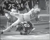  ?? THE ASSOCIATED PRESS ?? In this Dec. 31, 1972, file photo, Miami Dolphins Jim Kiick goes headfirst over Pittsburgh Steelers” Glen Edwards as Kiick scores in third quarter of the AFC championsh­ip game at Pittsburgh’s Three Rivers Stadium.