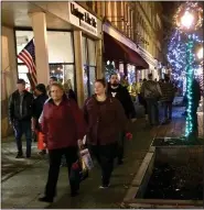  ?? THE NEWS-HERALD FILE ?? Shoppers tour the strip of vendors, merchants, and attraction­s during Painesvill­e’s 2019 Holiday Shop and Stroll. This year’s event will look a little different.