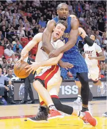  ?? LYNNE SLADKY/ASSOCIATED PRESS ?? Serge Ibaka, rear, shown wrapping up Miami’s Goran Dragic while with Orlando, is headed to Toronto after the Magic traded him Tuesday.