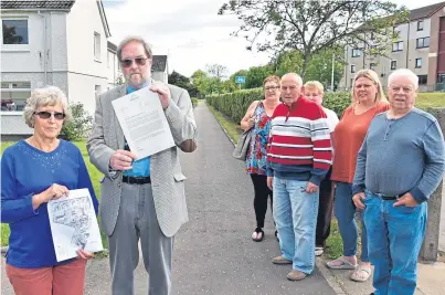  ??  ?? Furious residents of an Arbroath housing estate are refusing to pay £168 bills issued by housing associatio­n landlords for resurfacin­g paths around their homes.