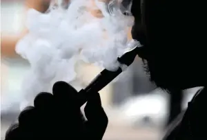  ?? PICTURE: AP ?? RISKY BUSINESS: E-cigarettes emit toxic vapours that break safety guidelines and can cause life-threatenin­g illnesses like cancer.