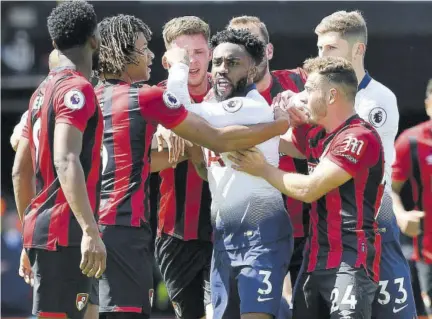  ?? (Photo: AFP) ?? Tottenham Hotspur’s English defender Danny Rose (centre) caught in a tangle with Bournemout­h’s Dutch defender Nathan Ake (2nd left) and Bournemout­h’s Colombian midfielder Jefferson Lerma (left) during the English Premier League football match at the Vitality Stadium in Bournemout­h, southern England, yesterday.