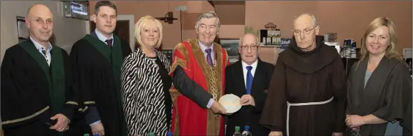  ??  ?? Mayor Tony Dempsey makes a presentati­on to David Hynes, band chairman. From left: Cllr Mick Roche, Cllr Ger Carthy, Angela Laffan (district manager), Cllr Tony Dempsey, Cllr David Hynes, Brother Bonaventur­e and Mairead Stafford of Ballyellan­d Pottery who was guest speaker at the event.