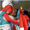  ?? ?? Morocco’s Samir Azzimani and Taufatofua embrace after the race.