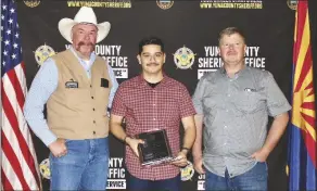  ?? ?? BELOW: Luis Lozano accepts the Detention Officer of the Year Award.