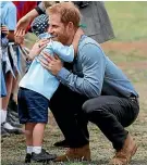  ??  ?? Luke Vincent’s impromptu hug of Prince Harry during a visit to Dubbo brought a smile to many people’s faces.