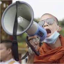  ??  ?? A Buddhist monk shouts anti-government slogans during a protest in Yangon on Wednesday. (AFP)