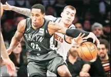  ??  ?? Denver Nuggets forward Juan Hernangome­z tries to strip the ball from Brooklyn Nets forward Rondae Hollis-Jefferson (24) during the first half ofan NBA basketball game, Feb 6 in New York. (AP)