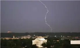  ??  ?? Lightning strikes above the Jefferson Memorial after a severe storm in Washington. Photograph: Yuri Gripas/Reuters