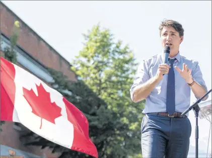  ?? CP PHOTO ?? Prime Minister Justin Trudeau speaks at a Canadian Red Cross fundraiser for victims of wildfires in British Columbia, in Revelstoke, B.C., on Saturday. Trudeau says he plans to visit British Columbia’s wildfire zones in the coming days as the situation...