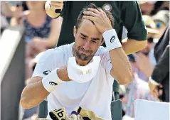  ??  ?? Bad day: Steve Johnson breaks down during defeat to Marin Cilic at Wimbledon last year