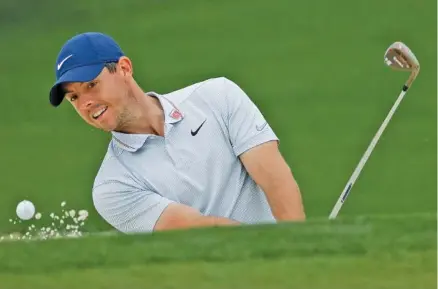  ?? AP PHOTO/MARCIO JOSE SANCHEZ ?? Rory McIlroy hits out of the bunker on the second hole during a practice round for the Masters on Monday at Augusta National.