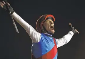  ?? MARTIN DOKOUPIL AP ?? Country Grammer’s jockey, Frankie Dettori, reacts after winning Grade I Dubai World Cup last year. Dettori will ride the 5-year-old in today’s San Antonio at Santa Anita.
