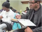  ?? BRAD VEST/THE COMMERCIAL APPEAL ?? Courtney Harris, a first-year education major, takes notes in Ronald Alexander’s Math 110: Concepts of Algebra class at LeMoyne-Owen College.