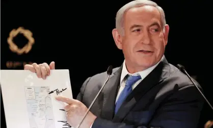  ?? Photograph: Atef Safadi/EPA ?? Benjamin Netanyahu points to the Golan Heights’ inclusion on a map of Israel featuring a comment by Donald Trump after meeting his son-in-law, Jared Kushner.