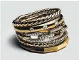  ??  ?? David Yurman’s 18-karat gold Stax Wide Ring with diamonds.